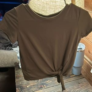 Green tight fitted shirt in size XS.